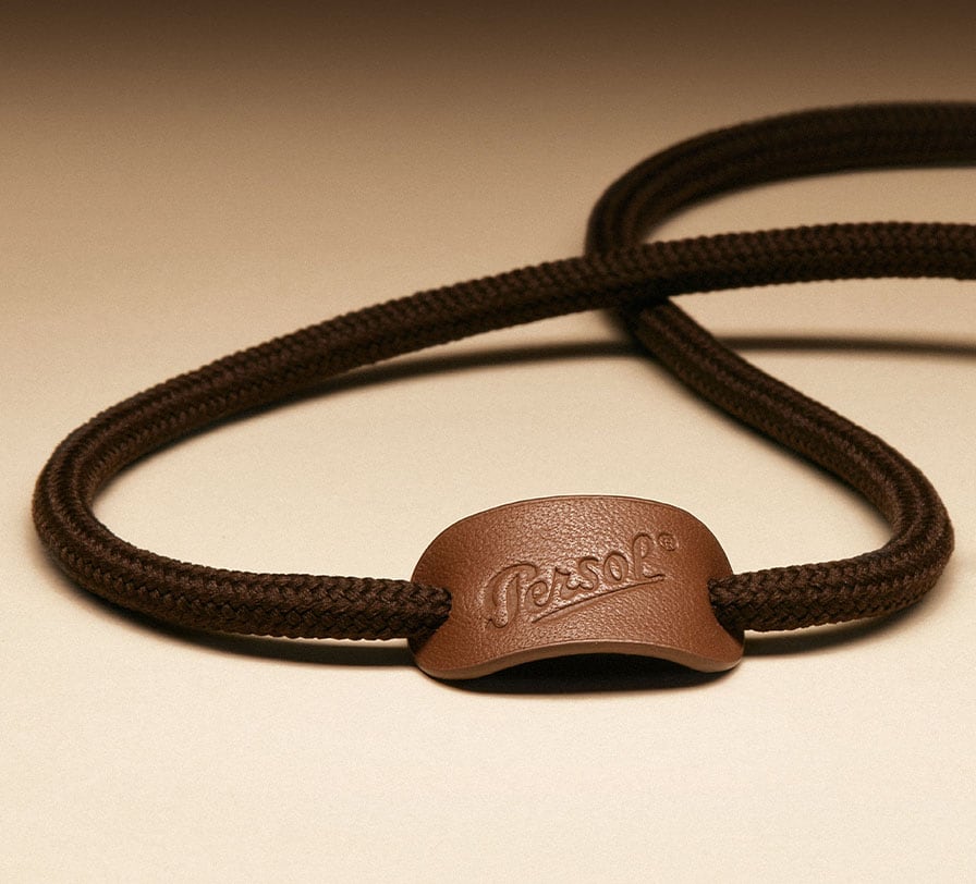 Strap with leather logo tag