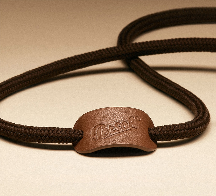 Strap with leather logo tag